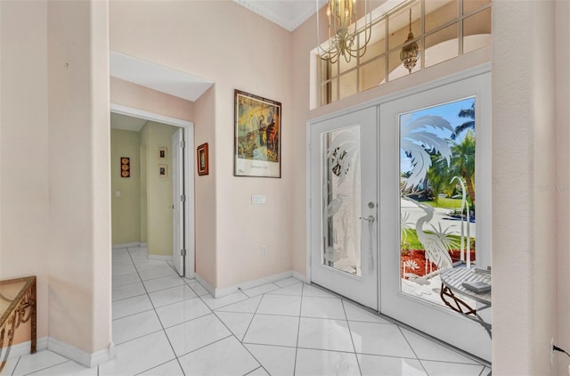 412 Panarea Dr, Punta Gorda, FL 33950 - foyer with plenty of natural light, french doors, and an inviting chandelier