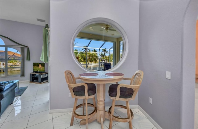 412 Panarea Dr, Punta Gorda, FL 33950 - dining room with visible vents, baseboards, light tile patterned flooring, and a ceiling fan