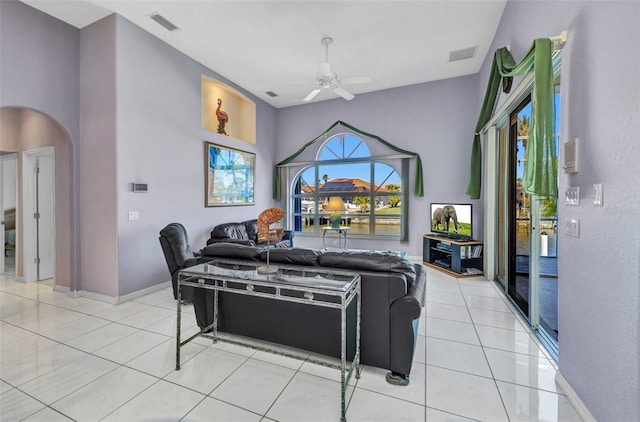412 Panarea Dr, Punta Gorda, FL 33950 - living area featuring visible vents, arched walkways, ceiling fan, and light tile patterned flooring
