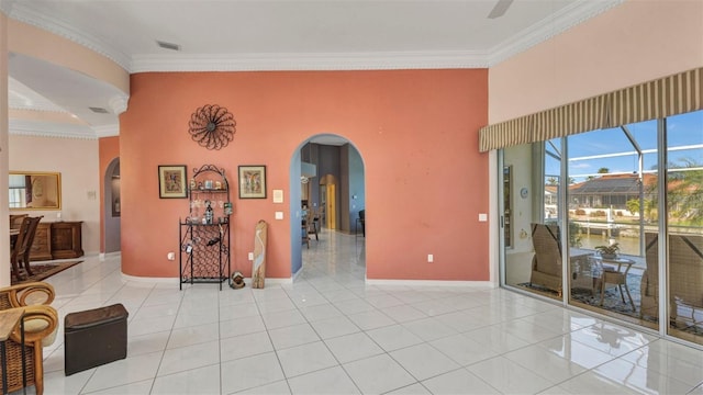 412 Panarea Dr, Punta Gorda, FL 33950 - unfurnished room featuring arched walkways, ornamental molding, and light tile patterned flooring