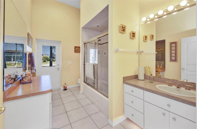 412 Panarea Dr, Punta Gorda, FL 33950 - full bath featuring vanity, baseboards, tile patterned flooring, toilet, and combined bath / shower with glass door