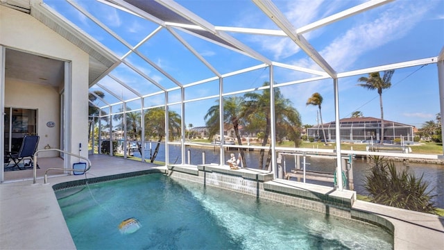 412 Panarea Dr, Punta Gorda, FL 33950 - pool featuring glass enclosure, a dock, a patio area, and a water view