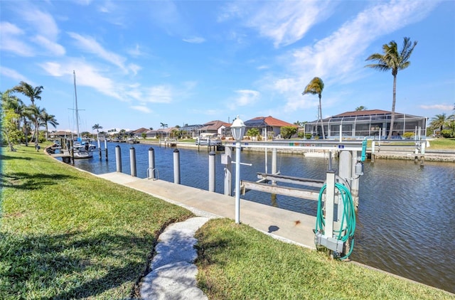 412 Panarea Dr, Punta Gorda, FL 33950 - view of dock with boat lift, a yard, and a water view