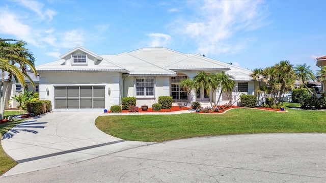 412 Panarea Dr, Punta Gorda, FL 33950 - ranch-style house with stucco siding, a tile roof, concrete driveway, a front yard, and an attached garage