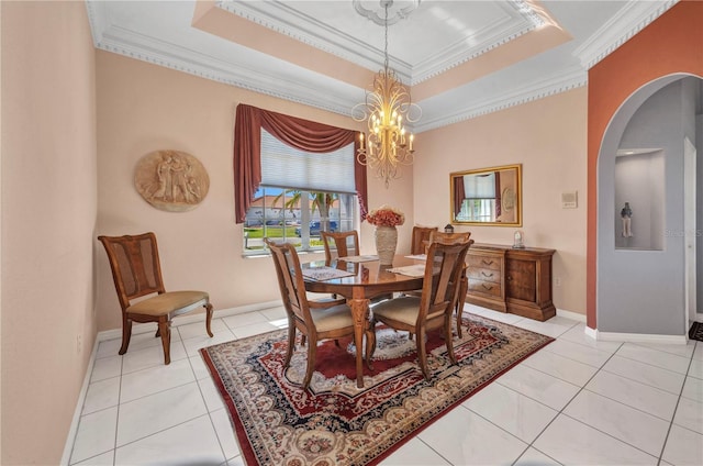 412 Panarea Dr, Punta Gorda, FL 33950 - dining area with ornamental molding, arched walkways, an inviting chandelier, light tile patterned floors, and a raised ceiling