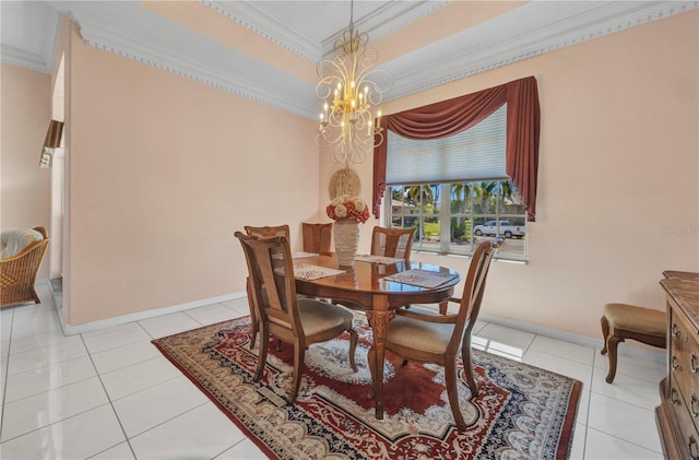 412 Panarea Dr, Punta Gorda, FL 33950 - dining area featuring a raised ceiling, ornamental molding, light tile patterned floors, and a chandelier