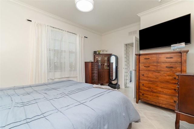 bedroom featuring ornamental molding, visible vents, and light tile patterned floors