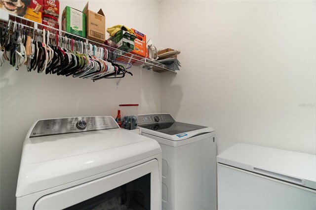 laundry area featuring laundry area and separate washer and dryer