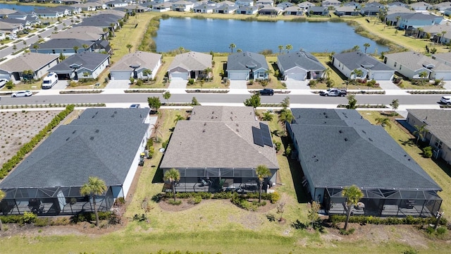 aerial view featuring a water view and a residential view