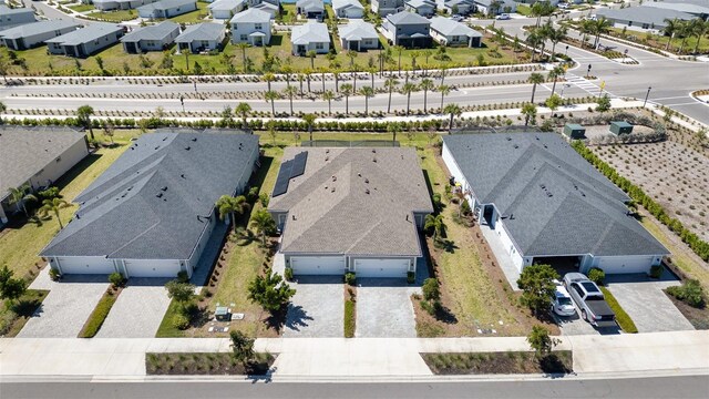 birds eye view of property with a residential view