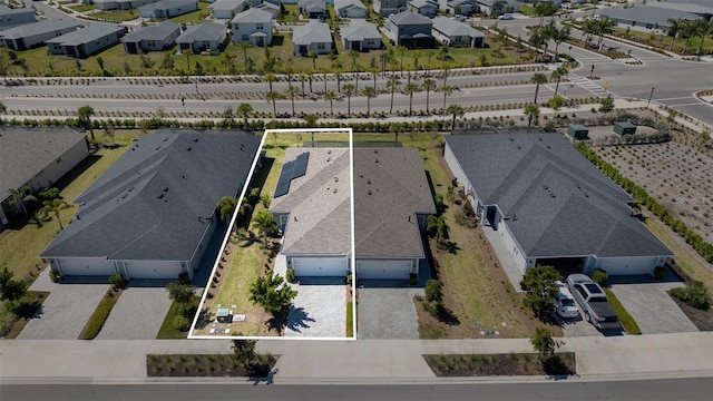 birds eye view of property with a residential view