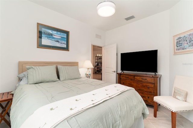 bedroom with visible vents and light tile patterned floors