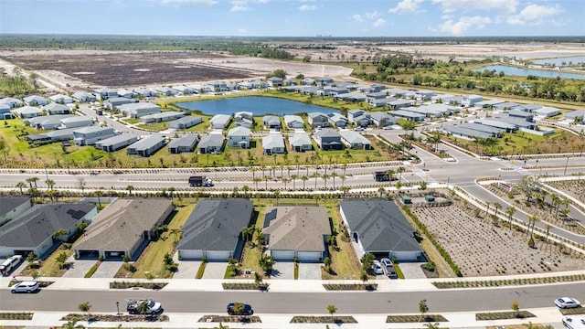 bird's eye view with a residential view and a water view