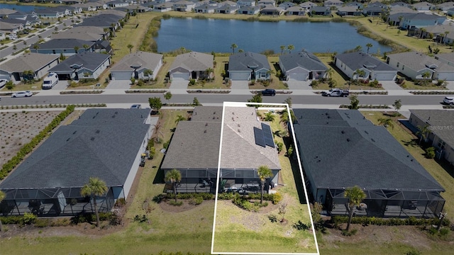 bird's eye view with a residential view and a water view