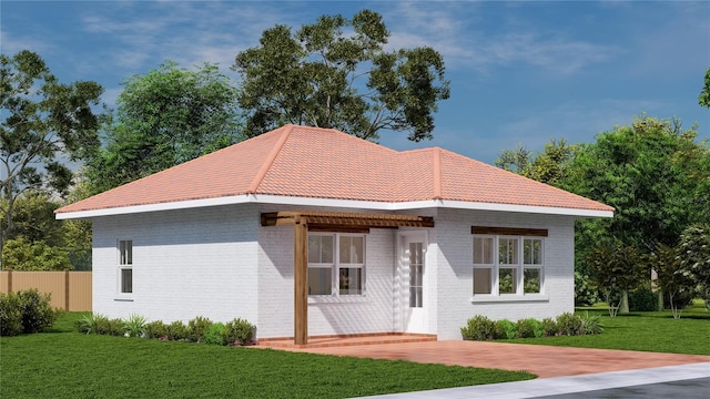 20208 Winkler Ave, Port Charlotte, FL 33954 - view of front of property with fence, brick siding, a front lawn, and a tile roof