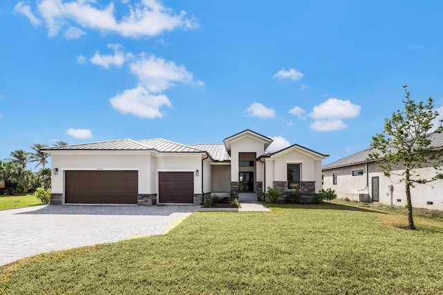 24259 Peppercorn Rd, Punta Gorda, FL 33955 - view of front of property with a standing seam roof, a garage, stone siding, decorative driveway, and metal roof