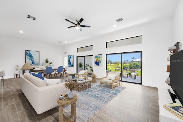 24259 Peppercorn Rd, Punta Gorda, FL 33955 - living area with ceiling fan, recessed lighting, visible vents, and wood tiled floor