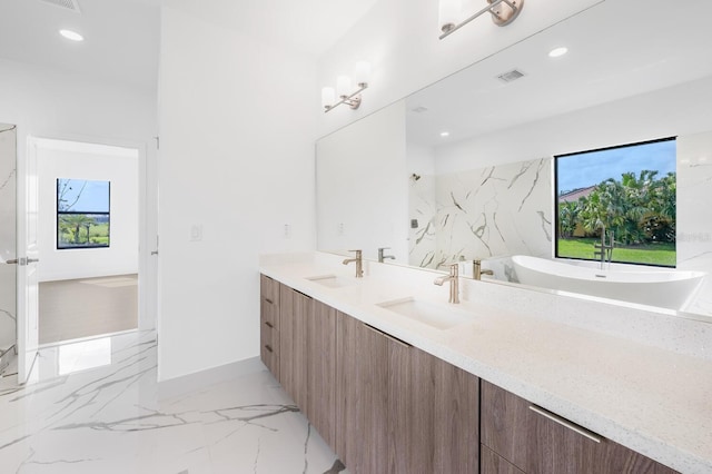 24259 Peppercorn Rd, Punta Gorda, FL 33955 - full bathroom with a sink, visible vents, marble finish floor, and double vanity