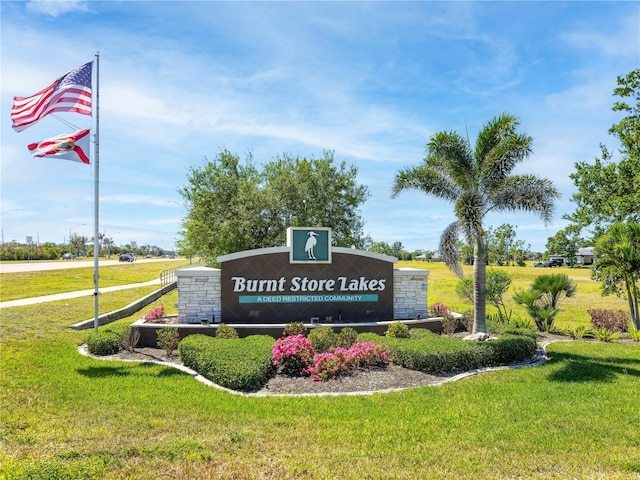 24259 Peppercorn Rd, Punta Gorda, FL 33955 - exterior space featuring a lawn