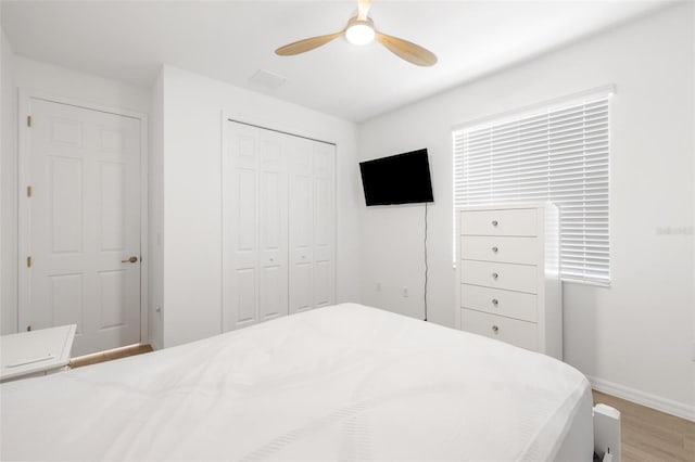 15931 Sugar Hill Dr, Punta Gorda, FL 33982 - bedroom with ceiling fan, a closet, light wood finished floors, and baseboards