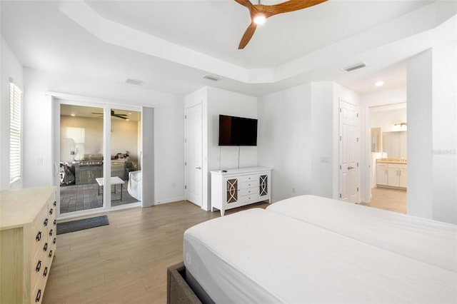 15931 Sugar Hill Dr, Punta Gorda, FL 33982 - bedroom with access to exterior, light wood finished floors, and visible vents
