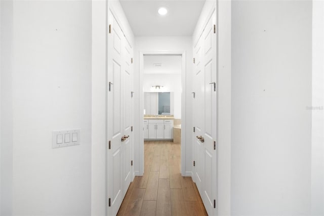 15931 Sugar Hill Dr, Punta Gorda, FL 33982 - corridor with wood finished floors and recessed lighting