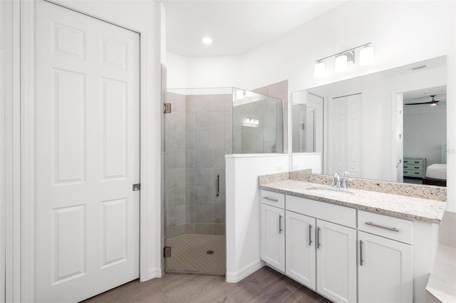 15931 Sugar Hill Dr, Punta Gorda, FL 33982 - ensuite bathroom featuring ensuite bathroom, a shower stall, vanity, and wood finished floors