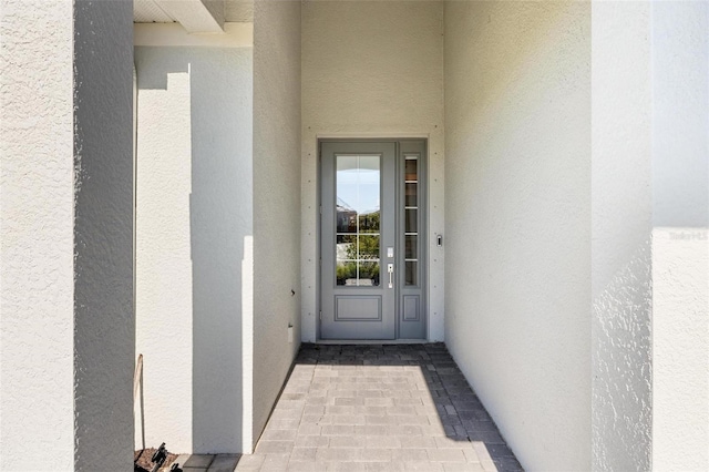15931 Sugar Hill Dr, Punta Gorda, FL 33982 - view of exterior entry featuring stucco siding
