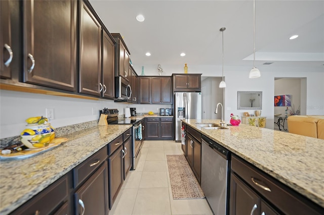 kitchen featuring recessed lighting, a sink, light tile patterned flooring, dark brown cabinets, and appliances with stainless steel finishes