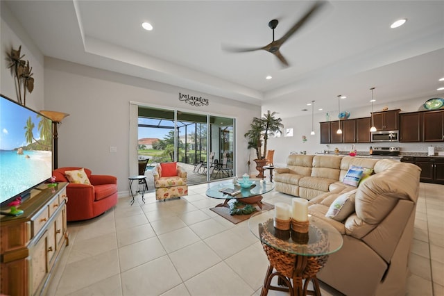 living area with ceiling fan, recessed lighting, and light tile patterned floors