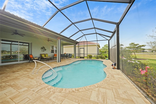 pool featuring ceiling fan, a lanai, and a patio area