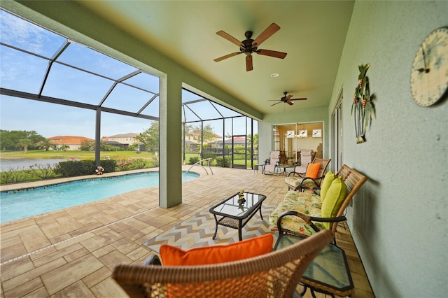 outdoor pool featuring a lanai, ceiling fan, and a patio