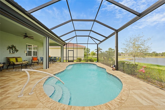 outdoor pool featuring a ceiling fan, outdoor lounge area, a lanai, a patio, and a water view