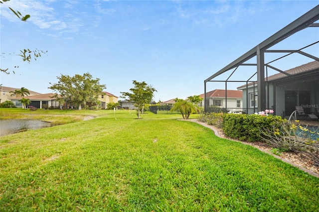 view of yard with glass enclosure