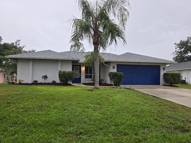 3753 Aba Ln, North Port, FL 34287 - single story home with stucco siding, an attached garage, concrete driveway, and a front yard