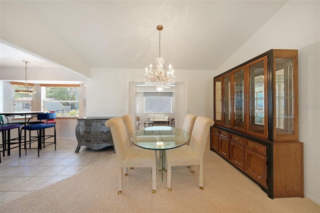 3753 Aba Ln, North Port, FL 34287 - dining area with a chandelier, lofted ceiling, light tile patterned flooring, and light carpet