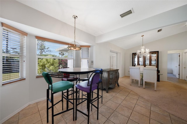 3753 Aba Ln, North Port, FL 34287 - dining area featuring a chandelier, lofted ceiling, light tile patterned flooring, and light carpet