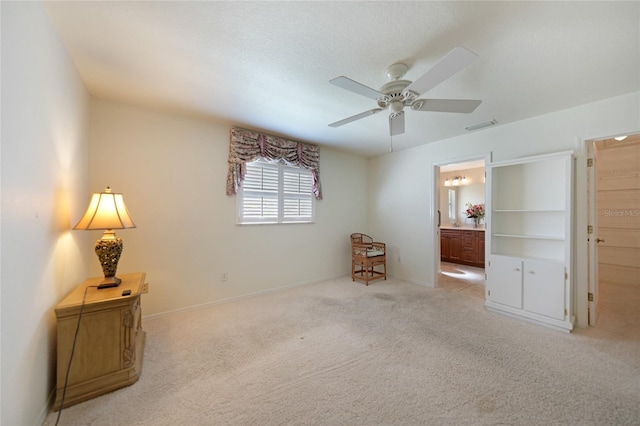 3753 Aba Ln, North Port, FL 34287 - bedroom with carpet flooring, connected bathroom, and a ceiling fan