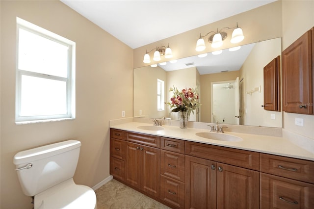 3753 Aba Ln, North Port, FL 34287 - full bath with double vanity, a ceiling fan, and tile patterned flooring