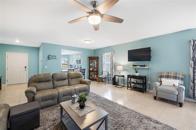 living room with tile patterned floors, baseboards, a ceiling fan, and recessed lighting