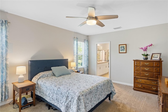 bedroom featuring baseboards, light carpet, a ceiling fan, connected bathroom, and visible vents