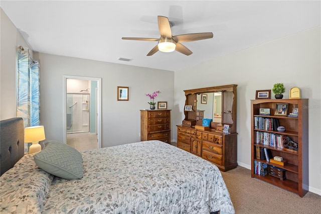 bedroom featuring visible vents, ensuite bathroom, baseboards, ceiling fan, and light colored carpet
