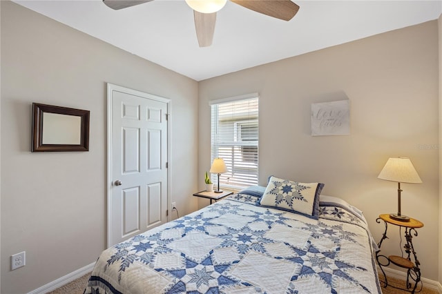 carpeted bedroom with baseboards and a ceiling fan