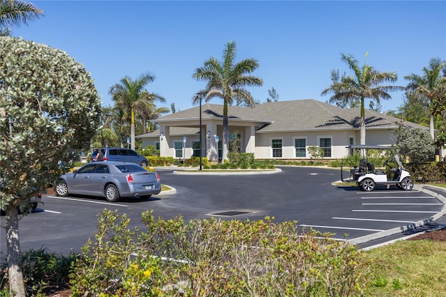 view of property featuring uncovered parking