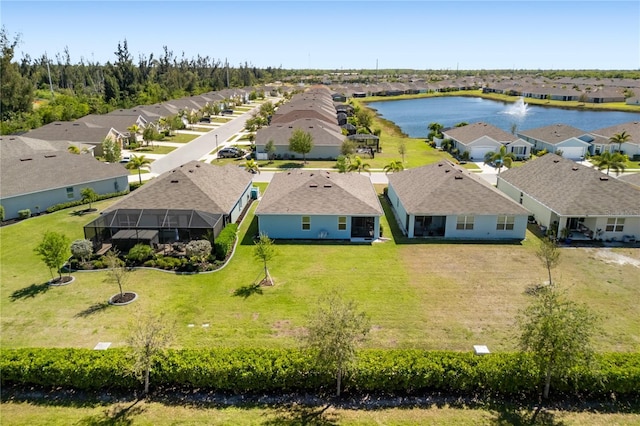 aerial view featuring a residential view and a water view