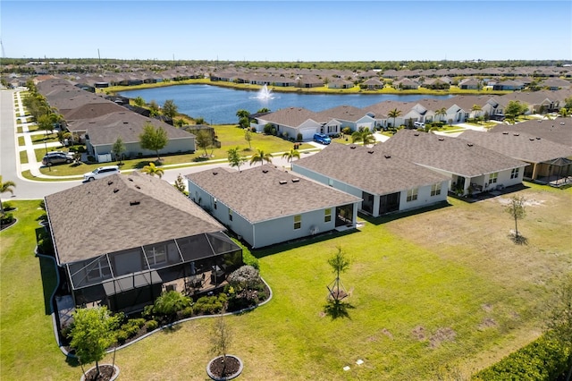 aerial view featuring a water view and a residential view