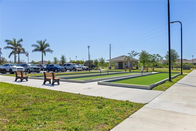 view of home's community with a yard