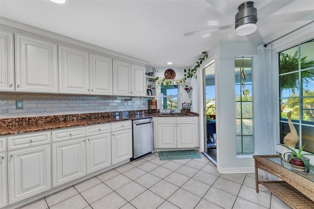 kitchen featuring dishwasher, light tile patterned floors, open shelves, decorative backsplash, and white cabinetry
