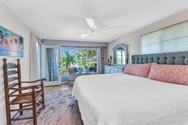 bedroom with a ceiling fan and access to outside