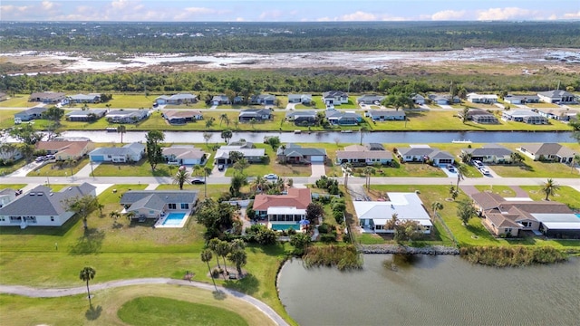 view of property location with nearby suburban area and a large body of water